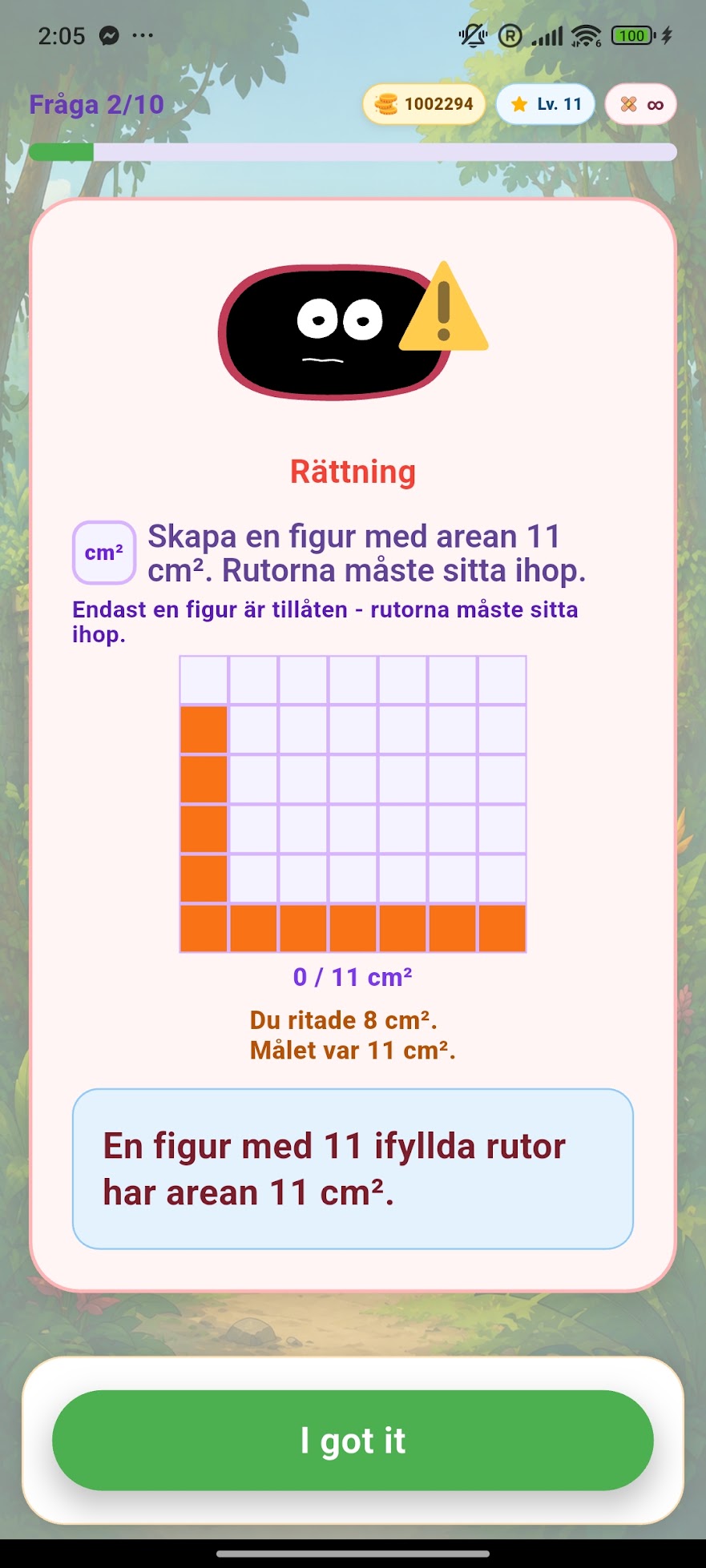 MathPops rättningsskärm som visar barnets figur mot målet och förklarar hur arean räknas i rutor